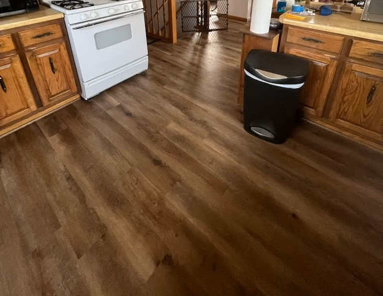 New wood-look plank flooring installed in a kitchen