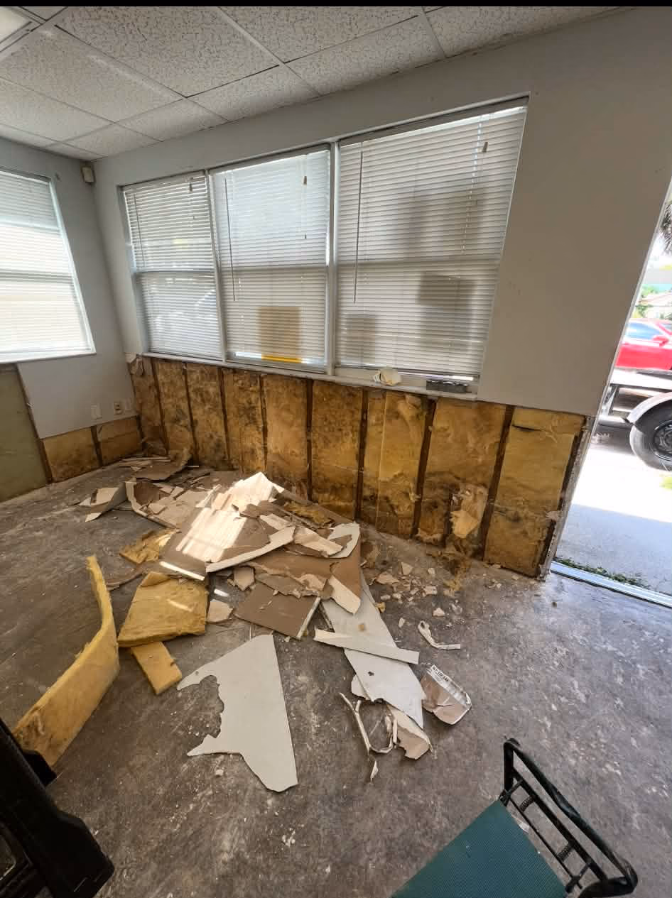 Flood cut showing the bottom section of sheetrock removed so the wall cavity can dry out